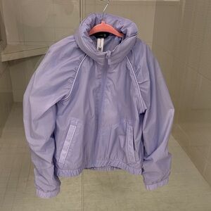 Girls All  in motion Lavender Mesh-Lined windbreaker with packable hidden hood.